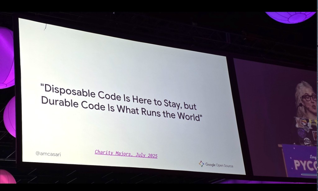 Amanda Casari delivers the closing keynote at PyCon US 2026 beside a slide that reads Disposable Code Is Here to Stay, but Durable Code Is What Runs the World, attributed to Charity Majors.
